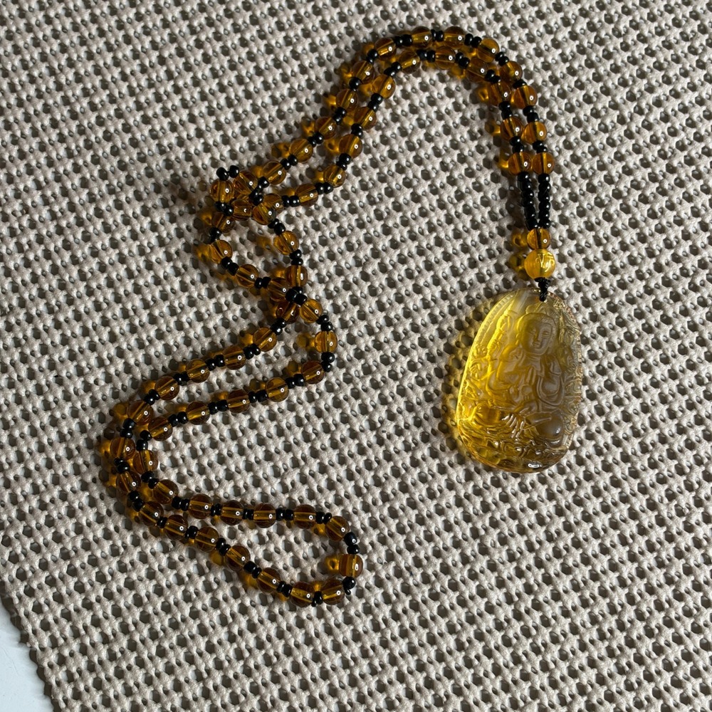 Carved Buddha Pendant Necklace Translucent Yellow Amber Tone Beaded Spiritual